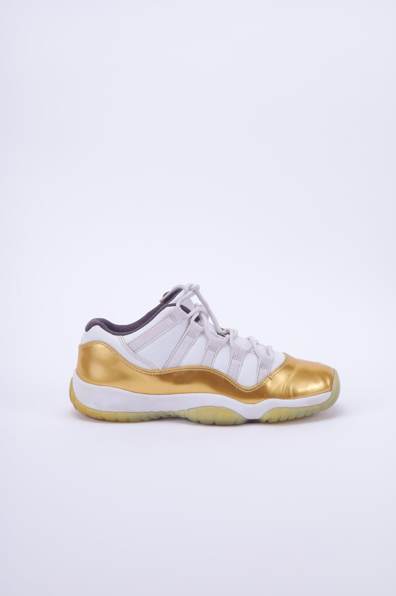 Gold jordan 11's best sale